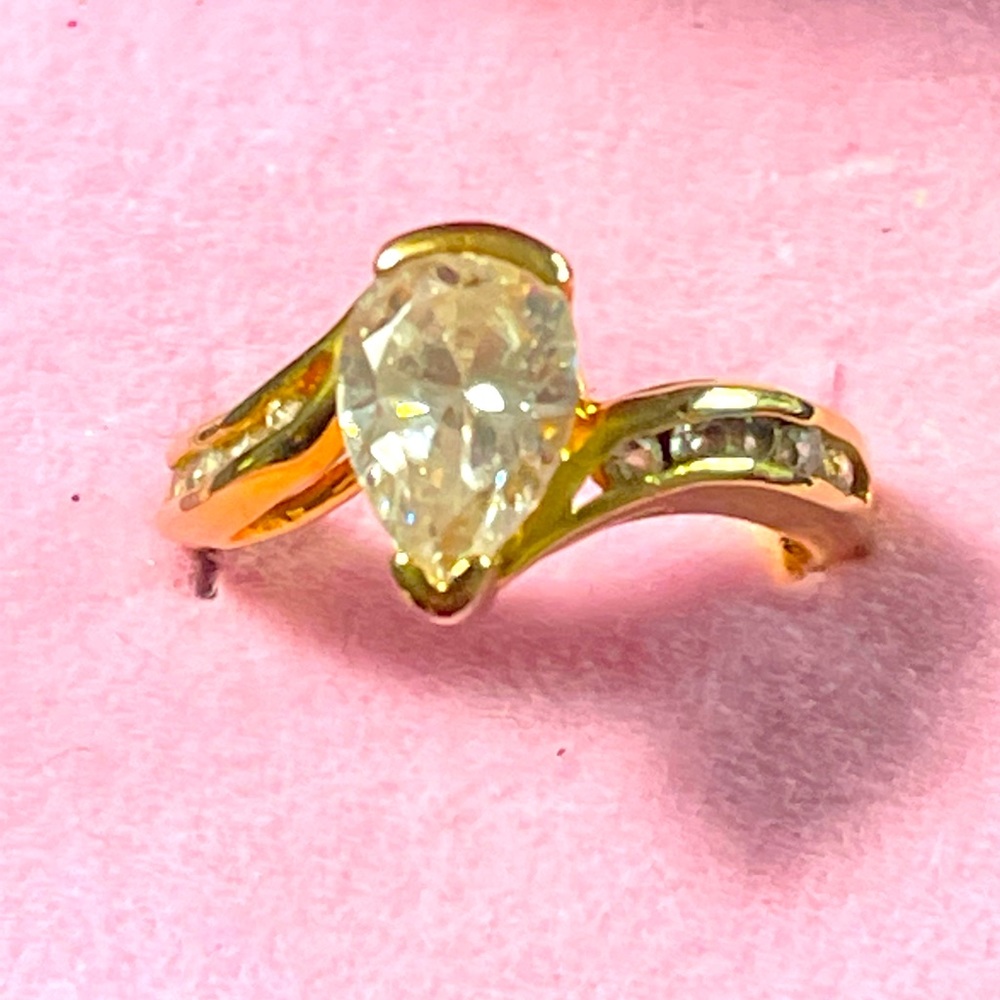 -14 KT Gold GE gold band with baguettes and a solitaire CZ diamond